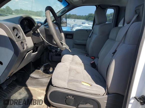 2005 Ford F-150 XL with VIN 1FTRF12255NB10143, listed as a Copart auction lot 67750754 with 250,615 mi miles and Salvage Title. Bid and sale history available at carsss.com. Image 7.