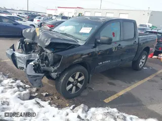 2010 Nissan Titan SE with VIN 1N6AA0EC7AN302682, listed as a IAAI auction lot 41619128 with 181,486 mi miles. Bid and sale history available at carsss.com. Image 2.
