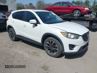 2016 Mazda CX-5 Grand Touring with VIN JM3KE4DY0G0632693, listed as a IAAI auction lot 42123142 with 106,592 mi miles. Bid and sale history available at carsss.com. Image 1.