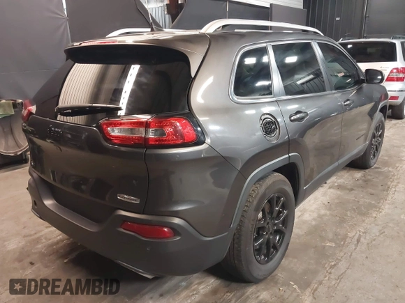 2016 Jeep Cherokee Latitude with VIN 1C4PJMCS4GW360475, listed as a IAAI auction lot 41479053 with 154,554 mi miles. Bid and sale history available at carsss.com. Image 4.