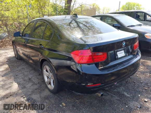 2014 BMW 3 Series 320i with VIN WBA3B1C56EK131849, listed as a IAAI auction lot 42018005 with 215,765 mi miles. Bid and sale history available at carsss.com. Image 3.