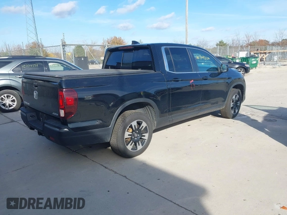 2020 Honda Ridgeline RTL with VIN 5FPYK3F59LB023212, listed as a IAAI auction lot 40704228 with 73,259 mi miles and . Bid and sale history available at DreamBid. Image 4.