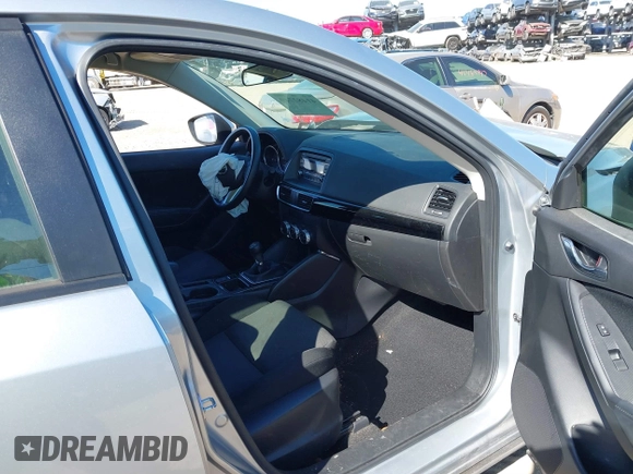 2016 Mazda CX-5 Sport with VIN JM3KE2BE9G0915168, listed as a IAAI auction lot 41482749 with 86,802 mi miles and . Bid and sale history available at carsss.com. Image 5.