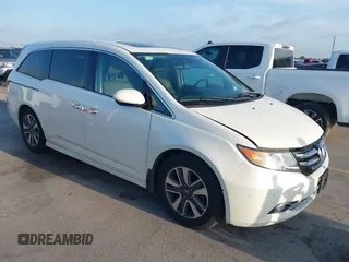 2014 Honda Odyssey Touring with VIN 5FNRL5H9XEB504644, listed as a IAAI auction lot 42571584 with 242,190 mi miles and . Bid and sale history available at DreamBid. Image 1.