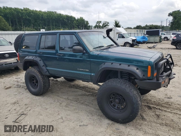 1997 Jeep Cherokee SE with VIN 1J4FJ28S2VL553709, listed as a Copart auction lot 63340974 with 154,029 mi miles and Clean Title. Bid and sale history available at carsss.com. Image 4.