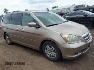 2005 Honda Odyssey EX-L with VIN 5FNRL38725B105441, listed as a IAAI auction lot 42726363 with 219,275 mi miles and . Bid and sale history available at DreamBid. Image 1.