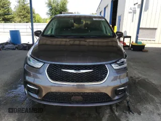2023 Chrysler Pacifica Touring L with VIN 2C4RC1BG1PR581376, listed as a Copart auction lot 59901915 with 57,411 mi miles and Salvage title. Bid and sale history available at DreamBid. Image 5.