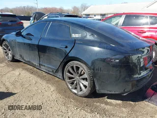 2014 Tesla Model S 60 with VIN 5YJSA1H1XEFP34226, listed as a IAAI auction lot 41806604 with 216,021 mi miles and . Bid and sale history available at DreamBid. Image 3.
