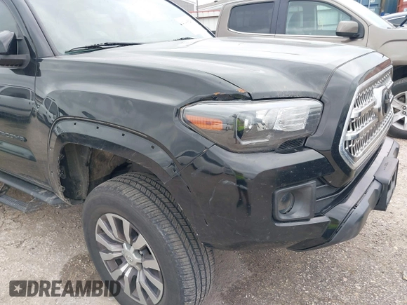 2017 Toyota Tacoma SR5 with VIN 5TFAZ5CN8HX052459, listed as a IAAI auction lot 41495281 with 212,314 mi miles and . Bid and sale history available at DreamBid. Image 6.