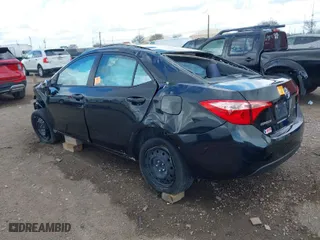 2019 Toyota Corolla L with VIN 5YFBURHE2KP935806, listed as a IAAI auction lot 41673090 with 61,926 mi miles. Bid and sale history available at carsss.com. Image 3.