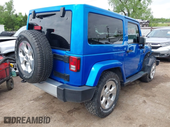 2015 Jeep Wrangler Sahara with VIN 1C4AJWBG9FL663959, listed as a IAAI auction lot 42133900 with 56,253 mi miles and . Bid and sale history available at DreamBid. Image 4.