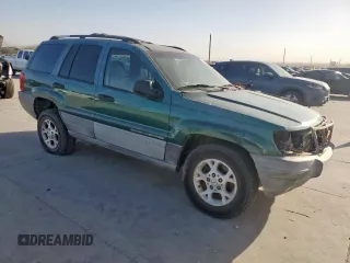 1999 Jeep Grand Cherokee Laredo with VIN 1J4G258S0XC561054, listed as a Copart auction lot 49814555 with Not provided miles and Salvage title. Bid and sale history available at DreamBid. Image 4.