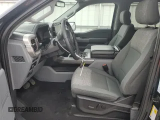 2023 Ford F-150 Lightning Pro with VIN 1FT6W1EV8PWG38071, listed as a Copart auction lot 51091495 with 13,687 mi miles and Salvage title. Bid and sale history available at DreamBid. Image 7.