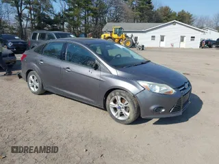 2014 Ford Focus SE with VIN 1FADP3F2XEL170580, listed as a IAAI auction lot 41752699 with 102,666 mi miles. Bid and sale history available at carsss.com. Image 1.
