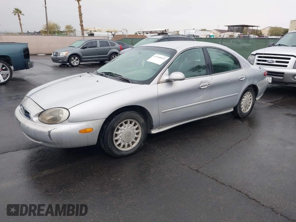 1997 Mercury Sable GS z VIN 1MELM50U8VG603194, wystawiony jako IAAI lot #41558010 z przebiegiem 265 169 mil mil oraz . Historia ofert i sprzedaży dostępna na DreamBid. Obrazek 2.