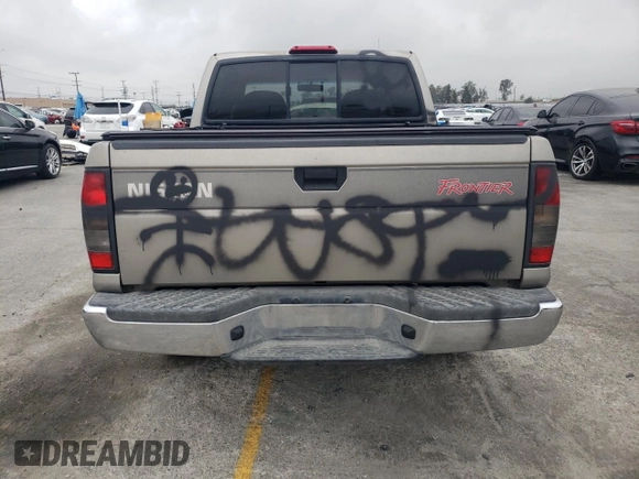 2000 Nissan Frontier XE with VIN 1N6ED27T8YC357939, listed as a Copart auction lot 55727395 with 143,842 mi miles and Salvage title. Bid and sale history available at DreamBid. Image 6.