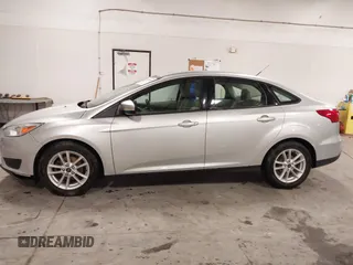 2017 Ford Focus SE z VIN 1FADP3F20HL245291, wystawiony jako IAAI lot #42194880 z przebiegiem 93 764 mil mil oraz . Historia ofert i sprzedaży dostępna na DreamBid. Obrazek 14.