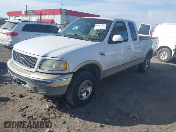 1999 Ford F-150 XL with VIN 1FTRX18L3XKB33860, listed as a IAAI auction lot 41664761 with 305,767 mi miles. Bid and sale history available at carsss.com. Image 2.