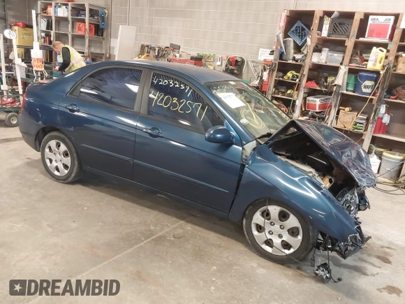 2004 Kia Spectra LX with VIN KNAFE121145012249, listed as a IAAI auction lot 42032571 with 146,748 mi miles. Bid and sale history available at carsss.com. Image 1.