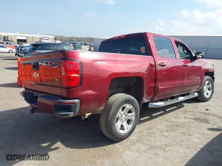 2016 Chevrolet Silverado 1500 LT with VIN 3GCUKREC0GG354271, listed as a IAAI auction lot 38948207 with 130,369 mi miles. Bid and sale history available at carsss.com. Image 4.