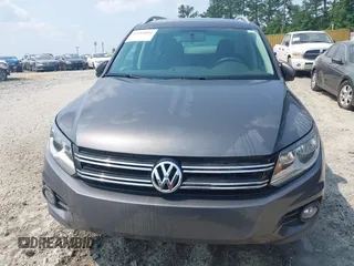 2014 Volkswagen Tiguan SE z VIN WVGAV3AX0EW576108, wystawiony jako IAAI lot #42405804 z przebiegiem 117 530 mil mil oraz . Historia ofert i sprzedaży dostępna na DreamBid. Obrazek 12.