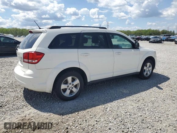 2013 Dodge Journey SE with VIN 3C4PDCAB3DT699816, listed as a Copart auction lot 52856455 with 67,688 mi miles and Salvage Title. Bid and sale history available at carsss.com. Image 3.