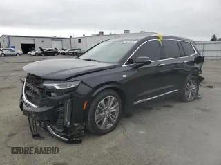 2022 Cadillac XT6 Premium Luxury with VIN 1GYKPDRS5NZ110989, listed as a Copart auction lot 69600894 with 56,148 mi miles and Salvage Title. Bid and sale history available at carsss.com. Image 1.