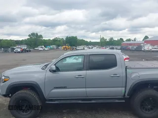 2021 Toyota Tacoma SR with VIN 5TFCZ5AN3MX258746, listed as a IAAI auction lot 42252967 with 62,095 mi miles and . Bid and sale history available at DreamBid. Image 14.