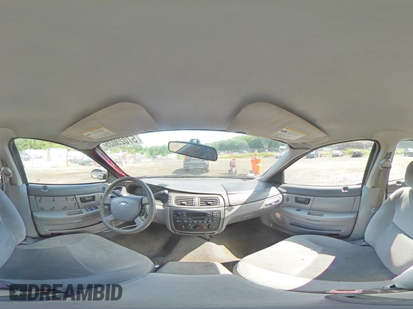 2005 Ford Taurus SE z VIN 1FAFP53U35A106807, wystawiony jako Copart lot #57023025 z przebiegiem 168 727 mil mil oraz Szkoda całkowita • Salvage title. Historia ofert i sprzedaży dostępna na DreamBid. Obrazek 14.