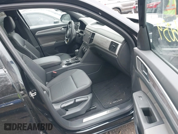 2023 Volkswagen Atlas SE z VIN 1V2HE2CA1PC210232, wystawiony jako IAAI lot #40966039 z przebiegiem 4 064 mil mil oraz . Historia ofert i sprzedaży dostępna na DreamBid. Obrazek 5.
