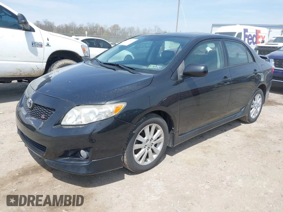 2009 Toyota Corolla with VIN 1NXBU40E29Z085117, listed as a IAAI auction lot 42059893 with 199,576 mi miles. Bid and sale history available at carsss.com. Image 2.