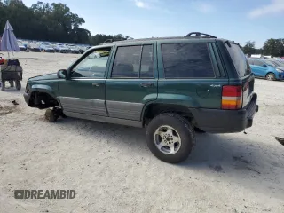 1996 Jeep Grand Cherokee Laredo with VIN 1J4GZ58S1TC340018, listed as a Copart auction lot 86571454 with 0 mi miles and Salvage Title. Bid and sale history available at carsss.com. Image 2.