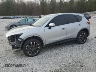 2016 Mazda CX-5 Grand Touring with VIN JM3KE2DY7G0781056, listed as a Copart auction lot 44183985 with 141,042 mi miles and Salvage Title. Bid and sale history available at carsss.com. Image 1.
