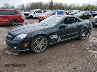 2009 Mercedes-Benz SL 55/63 AMG with VIN WDBSK70F79F157839, listed as a Copart auction lot 52350295 with 79,670 mi miles and Salvage title. Bid and sale history available at DreamBid. Image 1.