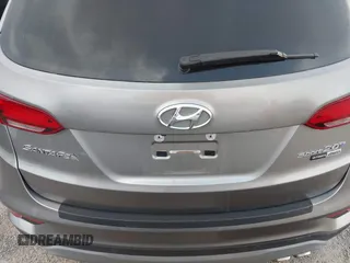 2018 Hyundai Santa Fe Ultimate with VIN 5NMZWDLAXJH100108, listed as a IAAI auction lot 42126768 with 68,325 mi miles and . Bid and sale history available at DreamBid. Image 16.