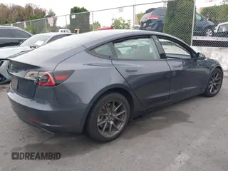 2023 Tesla Model 3 with VIN 5YJ3E1EA4PF705949, listed as a IAAI auction lot 42336682 with 88,056 mi miles and . Bid and sale history available at DreamBid. Image 4.