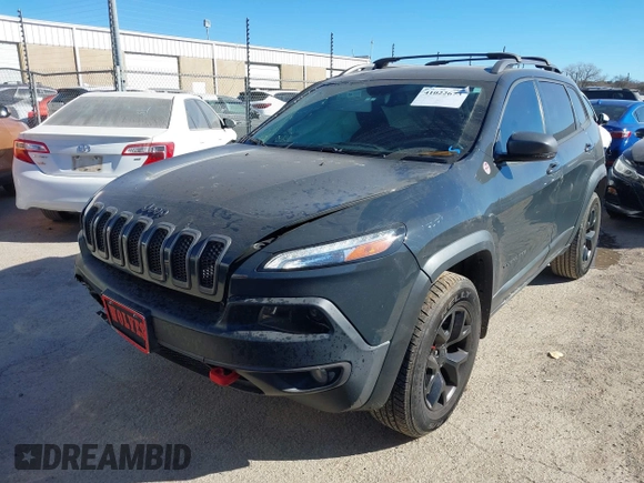 2017 Jeep Cherokee Trailhawk L Plus with VIN 1C4PJMBBXHW634944, listed as a IAAI auction lot 41022673 with 116,542 mi miles. Bid and sale history available at carsss.com. Image 2.
