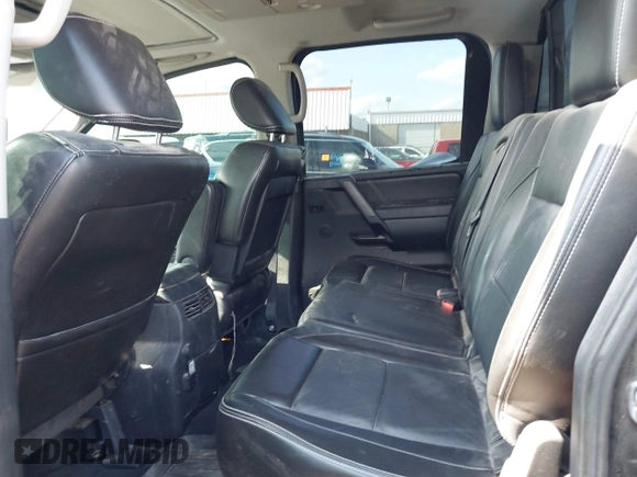 2013 Nissan Titan Pro-4X with VIN 1N6BA0EC4DN305032, listed as a IAAI auction lot 42341681 with 118,251 mi miles and . Bid and sale history available at DreamBid. Image 8.