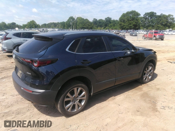 2022 Mazda CX-30 S Carbon Edition with VIN 3MVDMBCL6NM423255, listed as a IAAI auction lot 42209829 with 51,589 mi miles and . Bid and sale history available at DreamBid. Image 4.