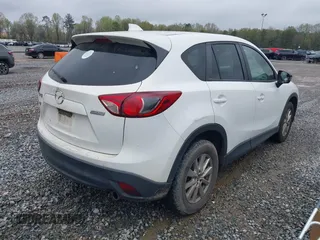 2015 Mazda CX-5 Touring with VIN JM3KE2CY4F0436664, listed as a IAAI auction lot 41876238 with 374,305 mi miles. Bid and sale history available at carsss.com. Image 4.