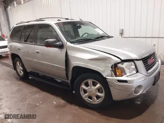 2004 GMC Envoy SLE with VIN 1GKDT13S042139622, listed as a IAAI auction lot 40546237 with 168,715 mi miles. Bid and sale history available at carsss.com. Image 1.
