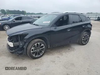 2016 Mazda CX-5 Grand Touring z VIN JM3KE2DY5G0676290, wystawiony jako Copart lot #54155325 z przebiegiem 124 743 mil mil oraz Szkoda całkowita • Salvage title. Historia ofert i sprzedaży dostępna na DreamBid. Obrazek 1.