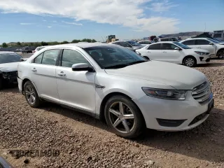 2015 Ford Taurus SEL with VIN 1FAHP2E92FG172960, listed as a Copart auction lot 79465914 with 115,115 mi miles and Salvage Title. Bid and sale history available at DreamBid. Image 4.