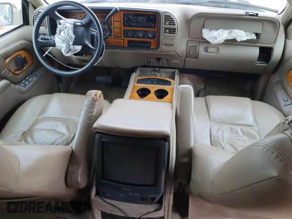 1999 Chevrolet Suburban with VIN 3GNEC16R9XG143471, listed as a Copart auction lot 53856565 with 208,621 mi miles and Salvage title. Bid and sale history available at DreamBid. Image 8.