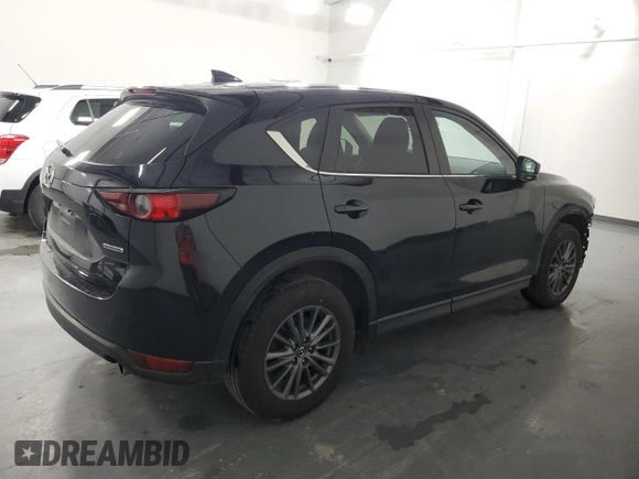 2021 Mazda CX-5 Touring with VIN JM3KFBCMXM0338844, listed as a Copart auction lot 53201615 with 137,498 mi miles and Clean Title. Bid and sale history available at carsss.com. Image 3.