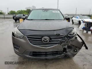 2016 Mazda CX-5 Grand Touring with VIN JM3KE2DY4G0811386, listed as a Copart auction lot 51961795 with 99,525 mi miles and Salvage Title. Bid and sale history available at carsss.com. Image 5.