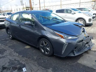 2022 Toyota Prius L Eco with VIN JTDKAMFU7N3155268, listed as a IAAI auction lot 41589024 with 158,430 mi miles. Bid and sale history available at carsss.com. Image 1.
