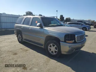 2003 GMC Yukon Denali z VIN 1GKEK63U93J339277, wystawiony jako Copart lot #42454275 z przebiegiem Nie podano mil oraz Szkody całkowita. Historia ofert i sprzedaży dostępna na DreamBid. Obrazek 4.