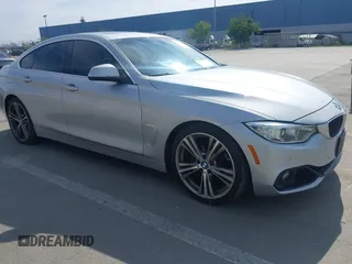 2016 BMW 4 Series 428i with VIN WBA4A9C55GG695469, listed as a IAAI auction lot 41753857 with 90,692 mi miles. Bid and sale history available at carsss.com. Image 1.