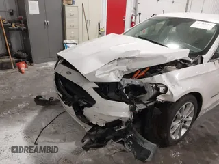 2019 Ford Fusion Hybrid SEL with VIN 3FA6P0MU8KR272811, listed as a IAAI auction lot 41705282 with 56,565 mi miles. Bid and sale history available at carsss.com. Image 6.